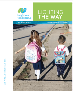 Banner for Neighbors to Nicaragua campaign showing two children with backpacks walking on a sidewalk, with'Lighting the Way' slogan on a green panel.